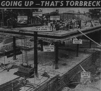 An image of the lift slab construction of the garden block under way. (Courier-Mail 12th February 1959).